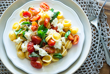 pasta creamy shells infused chili tomatoes fresh oil plate